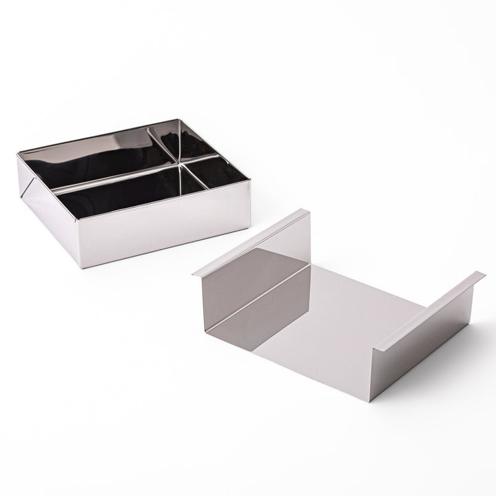 Japanese stainless steel Nagashikan jelly mold shown next to its separated removable inner tray on white background