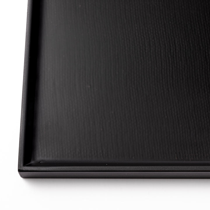 Modern Japanese Lacquer Serving Tray in sleek black with a textured horizontal grain pattern and subtle side grooves for easy handling.