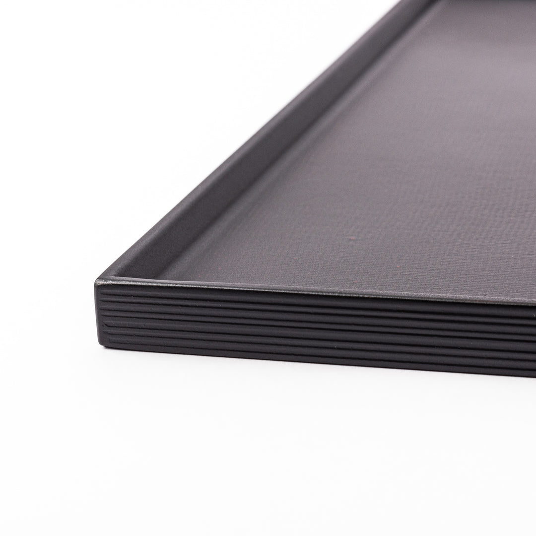 Modern Japanese Lacquer Serving Tray in sleek black with a textured horizontal grain pattern and subtle side grooves for easy handling.