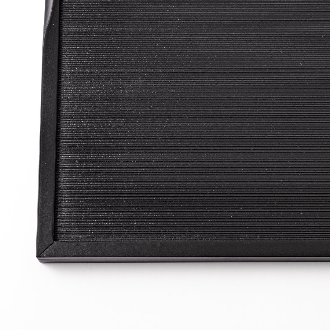 Modern Japanese Lacquer Serving Tray in sleek black with a textured horizontal grain pattern and subtle side grooves for easy handling.