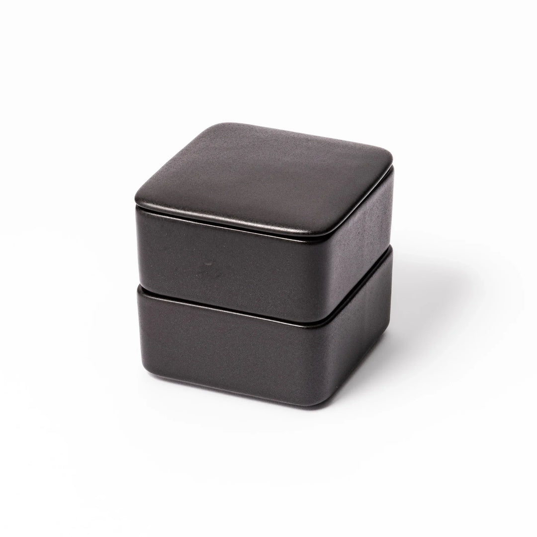 Sleek black Japanese porcelain bento box set, two-tiered design for modern, minimalist meal presentation and versatile storage.