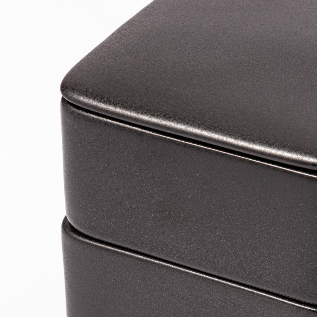 Sleek black Japanese porcelain bento box set, two-tiered design for modern, minimalist meal presentation and versatile storage.
