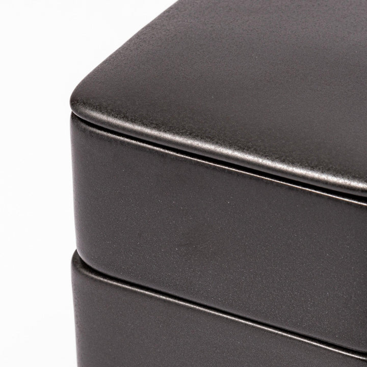 Sleek black Japanese porcelain bento box set, two-tiered design for modern, minimalist meal presentation and versatile storage.