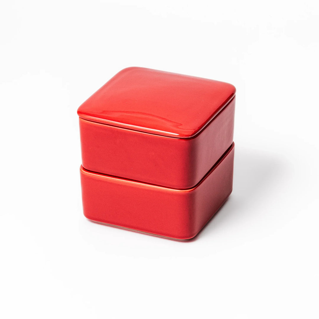 Vibrant red Japanese porcelain bento box set, two-tiered square design for stylish, modern dining and versatile meal presentation.