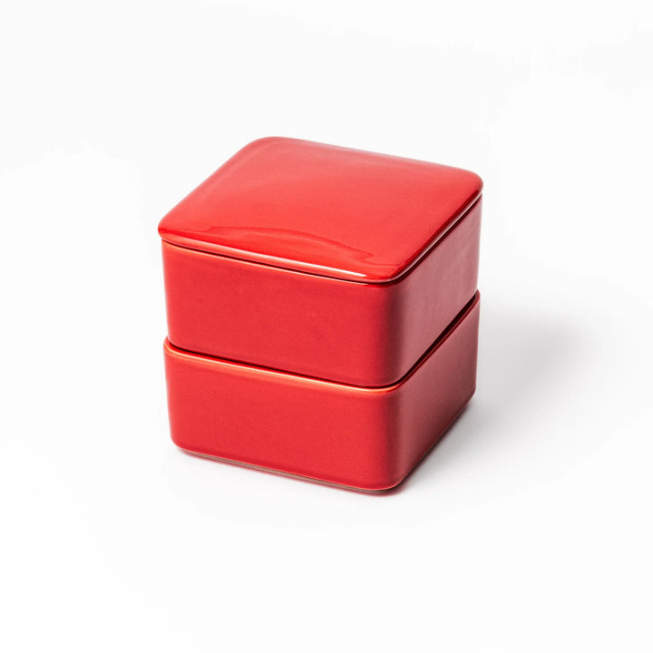 Vibrant red Japanese porcelain bento box set, two-tiered square design for stylish, modern dining and versatile meal presentation.