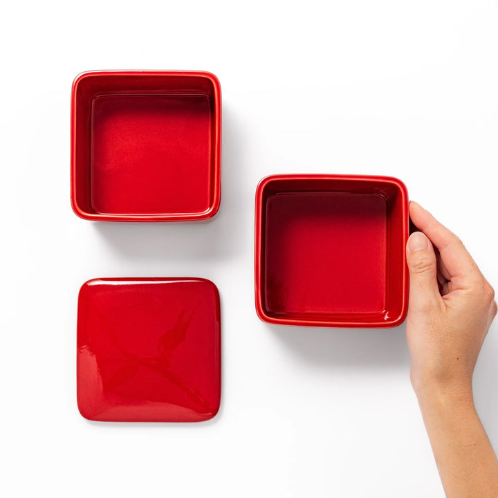 Vibrant red Japanese porcelain bento box set, two-tiered square design for stylish, modern dining and versatile meal presentation.