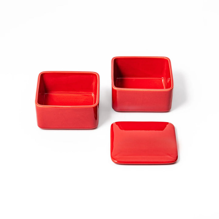 Vibrant red Japanese porcelain bento box set, two-tiered square design for stylish, modern dining and versatile meal presentation.