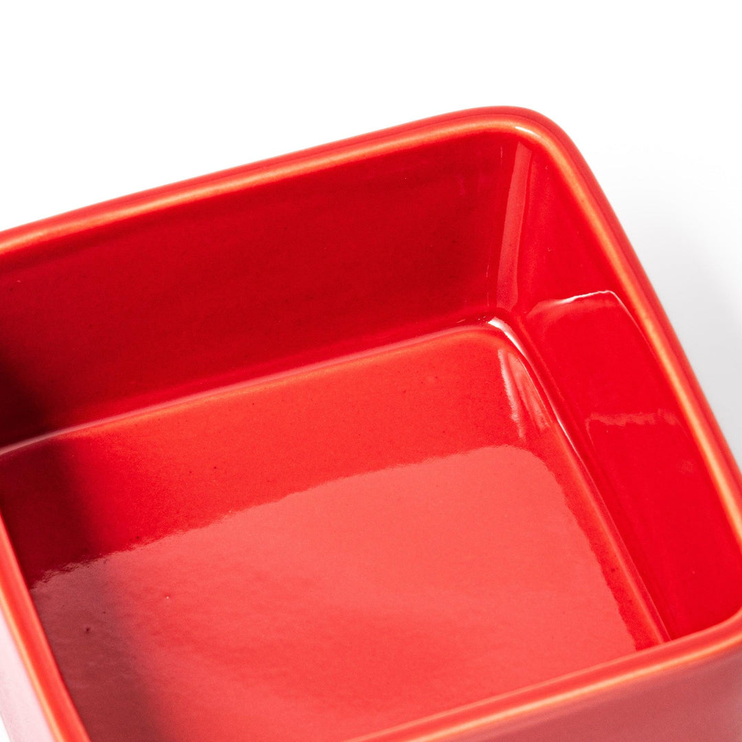 Vibrant red Japanese porcelain bento box set, two-tiered square design for stylish, modern dining and versatile meal presentation.