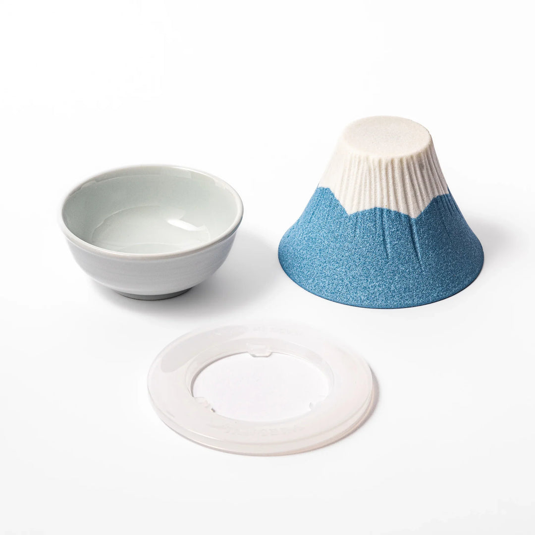 Sky blue Mount Fuji ceramic coffee filter with snowy peak, handcrafted in Japan for reusable pour-over brewing and unique kitchen decor.