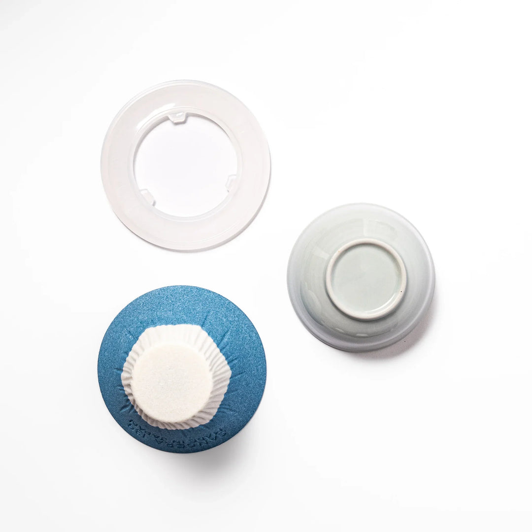Sky blue Mount Fuji ceramic coffee filter with snowy peak, handcrafted in Japan for reusable pour-over brewing and unique kitchen decor.