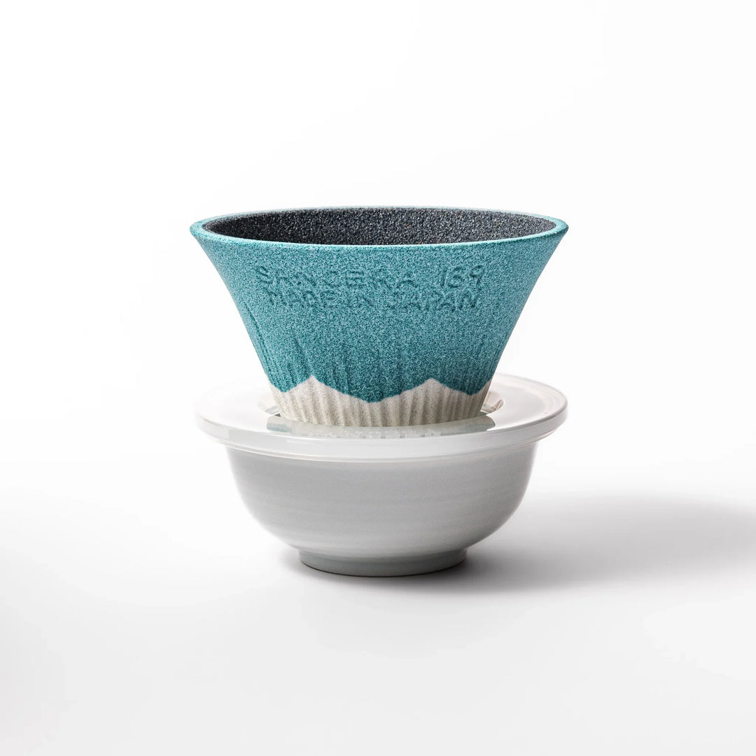 Turquoise Mount Fuji ceramic coffee filter with snowy peak design, handcrafted in Japan for reusable pour-over brewing and unique kitchen decor.
