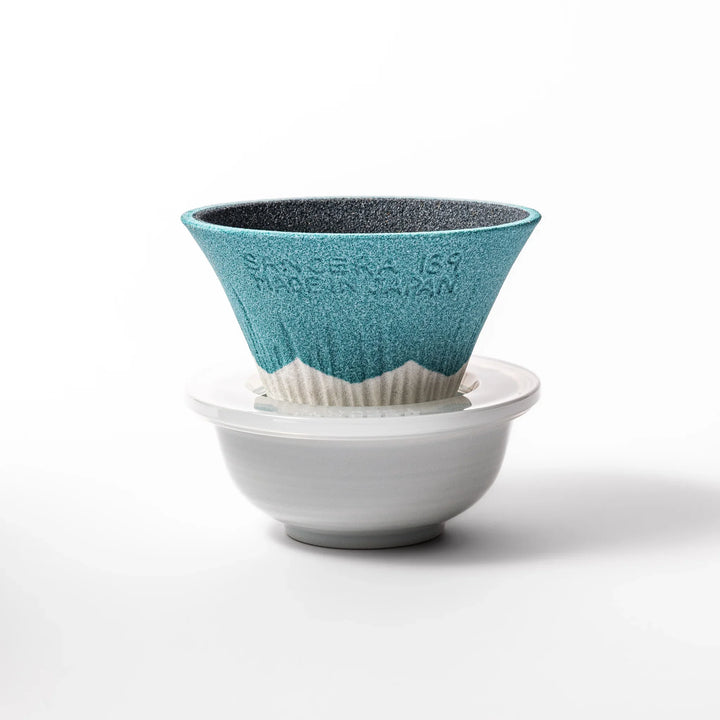 Turquoise Mount Fuji ceramic coffee filter with snowy peak design, handcrafted in Japan for reusable pour-over brewing and unique kitchen decor.