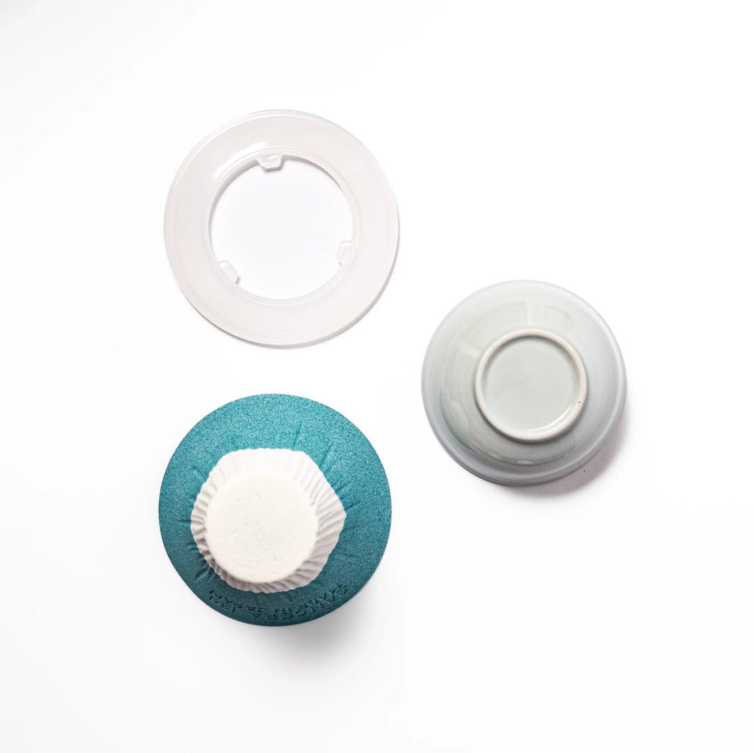 Turquoise Mount Fuji ceramic coffee filter with snowy peak design, handcrafted in Japan for reusable pour-over brewing and unique kitchen decor.