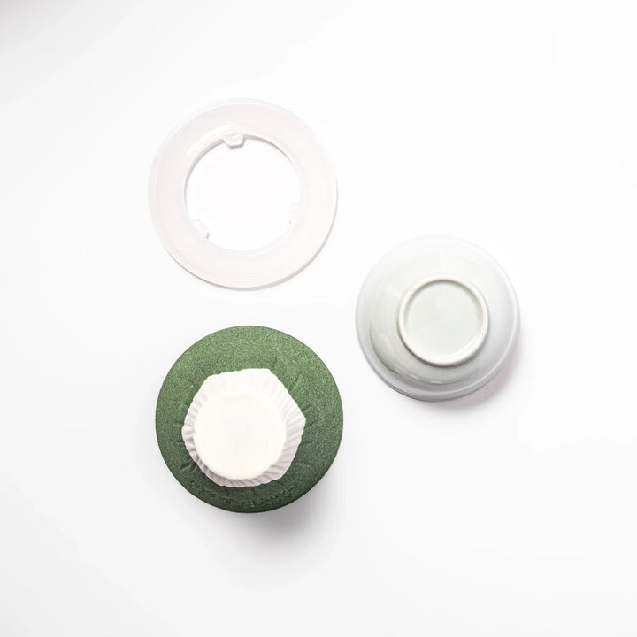Matcha green Mount Fuji ceramic coffee filter with snowy peak design, handcrafted in Japan for reusable pour-over brewing and stylish kitchen decor.