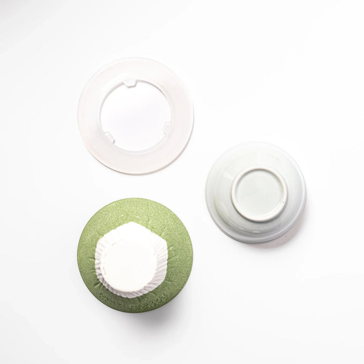 Wasabi green Mount Fuji ceramic coffee filter with snowy peak design, handmade in Japan for reusable pour-over brewing and kitchen decor.