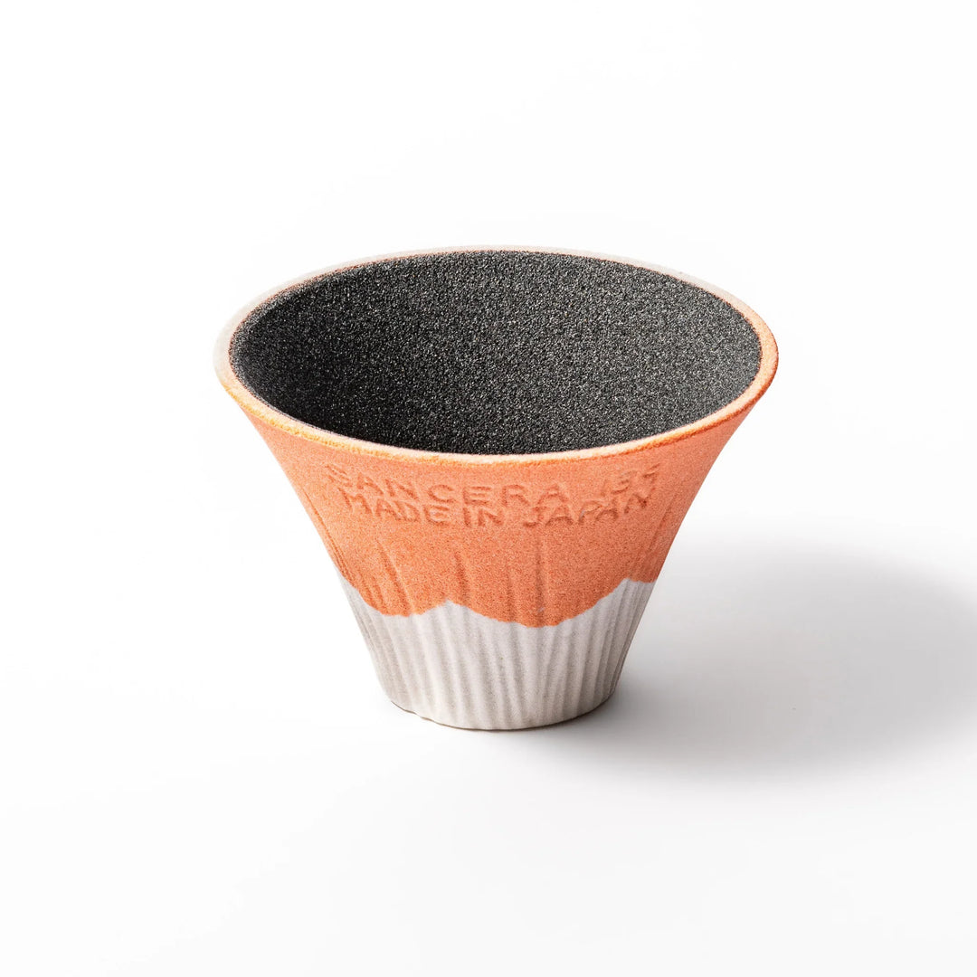 Orange Mount Fuji ceramic coffee filter with snowy peak design, handcrafted in Japan for reusable pour-over brewing and modern kitchen decor.