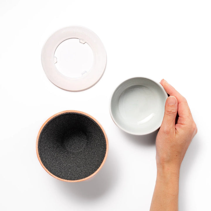 Orange Mount Fuji ceramic coffee filter with snowy peak design, handcrafted in Japan for reusable pour-over brewing and modern kitchen decor.