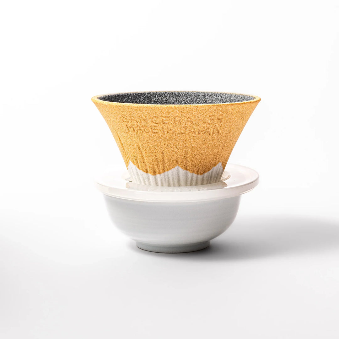 Sunflower yellow Mount Fuji ceramic coffee filter with snowy peak design, handcrafted in Japan for eco-friendly pour-over brewing and decor.