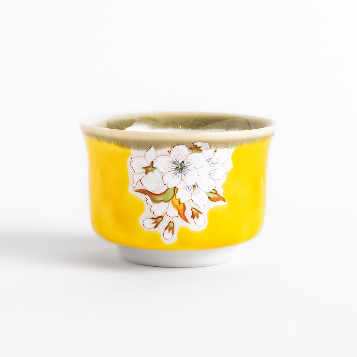 Yellow sake cup with a delicate cherry blossom design, perfectly complementing spring-themed tableware for a vibrant and charming dining experience.