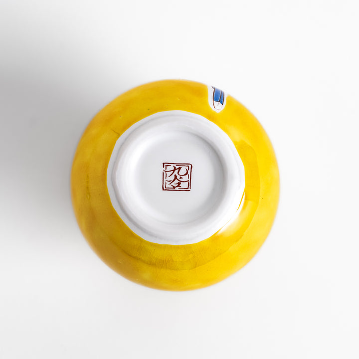 Yellow sake bottle featuring a vibrant cherry blossom and bird design, perfect for adding a touch of spring beauty to your tableware collection.