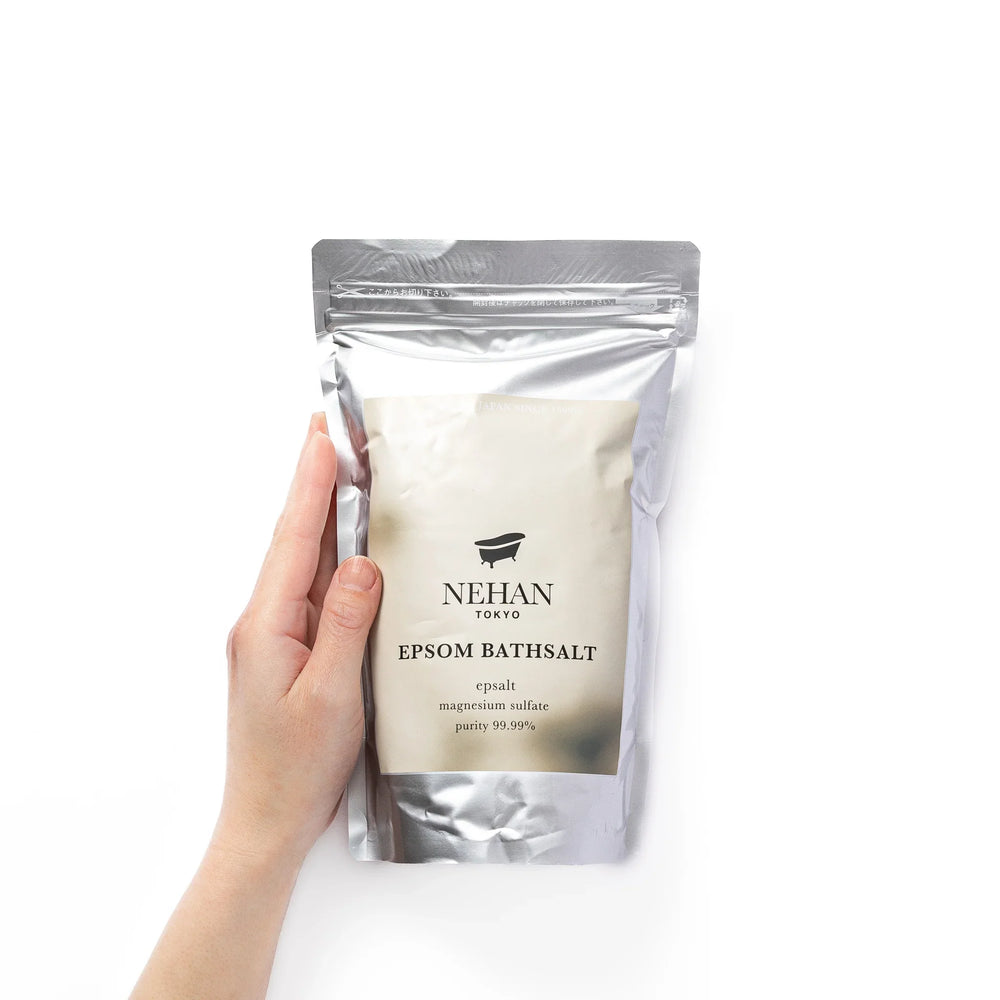 High purity NEHAN TOKYO unscented Epsom salt bath soak in a silver standing pouch for a relaxing magnesium sulfate bath