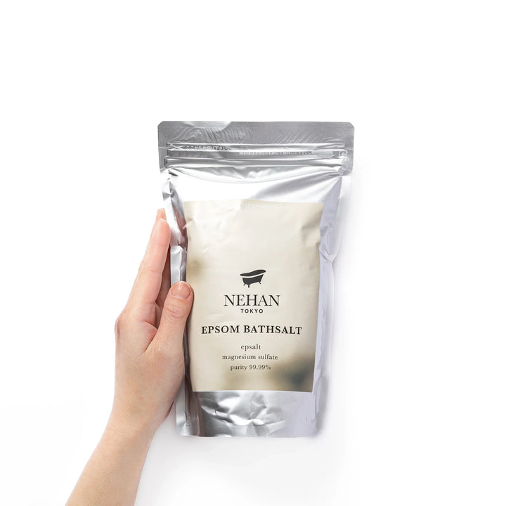 High purity NEHAN TOKYO unscented Epsom salt bath soak in a silver standing pouch for a relaxing magnesium sulfate bath