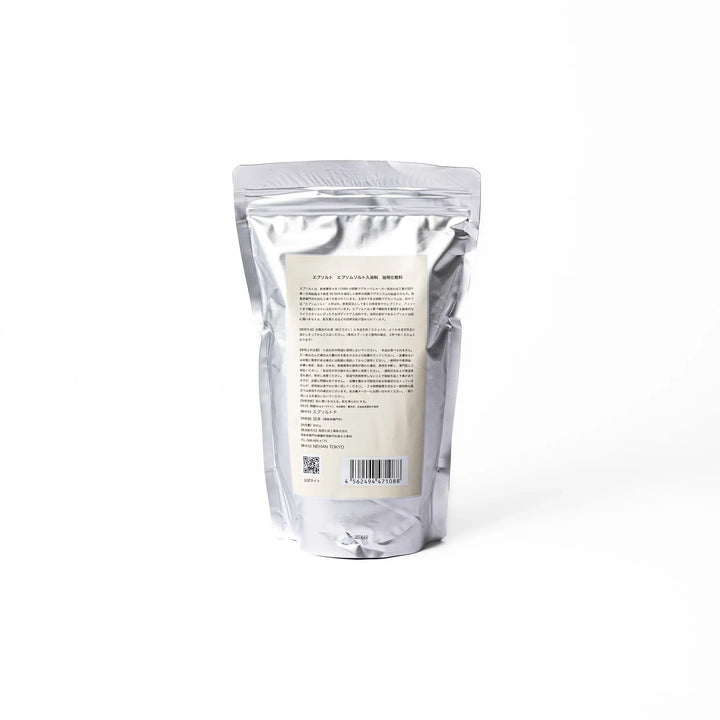 High purity NEHAN TOKYO unscented Epsom salt bath soak in a silver standing pouch for a relaxing magnesium sulfate bath