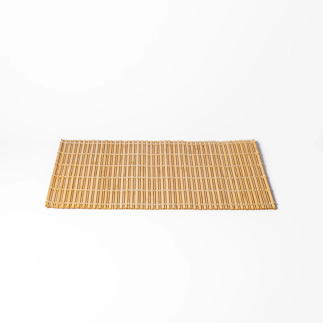 Natural finish bamboo table mat with slim vertical slats and white cord binding, offering a clean, earthy touch to traditional Japanese table settings.