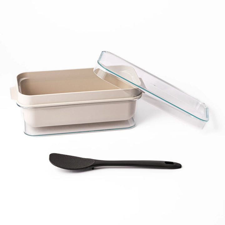 Japanese nukazuke fermentation box with clear lid and black rice paddle for home pickling and storage.