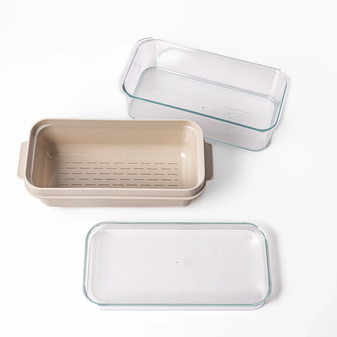 Japanese nukazuke fermentation box with clear lid and black rice paddle for home pickling and storage.
