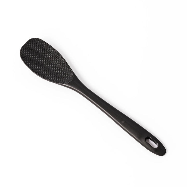 Black mixing spatula with textured surface designed for stirring and maintaining Japanese nukazuke fermentation.