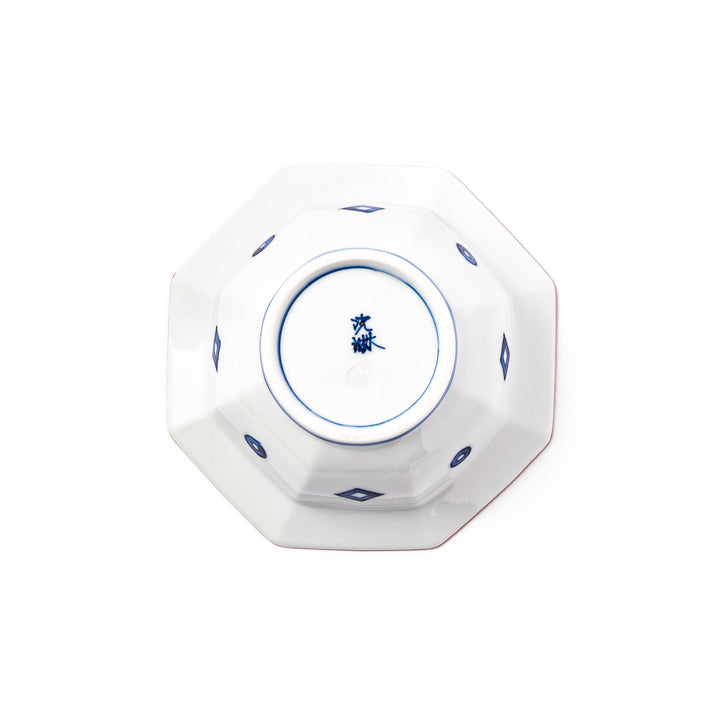 White octagonal dessert bowl with blue floral garland patterns and a red-rimmed edge, featuring intricate geometric detailing.
