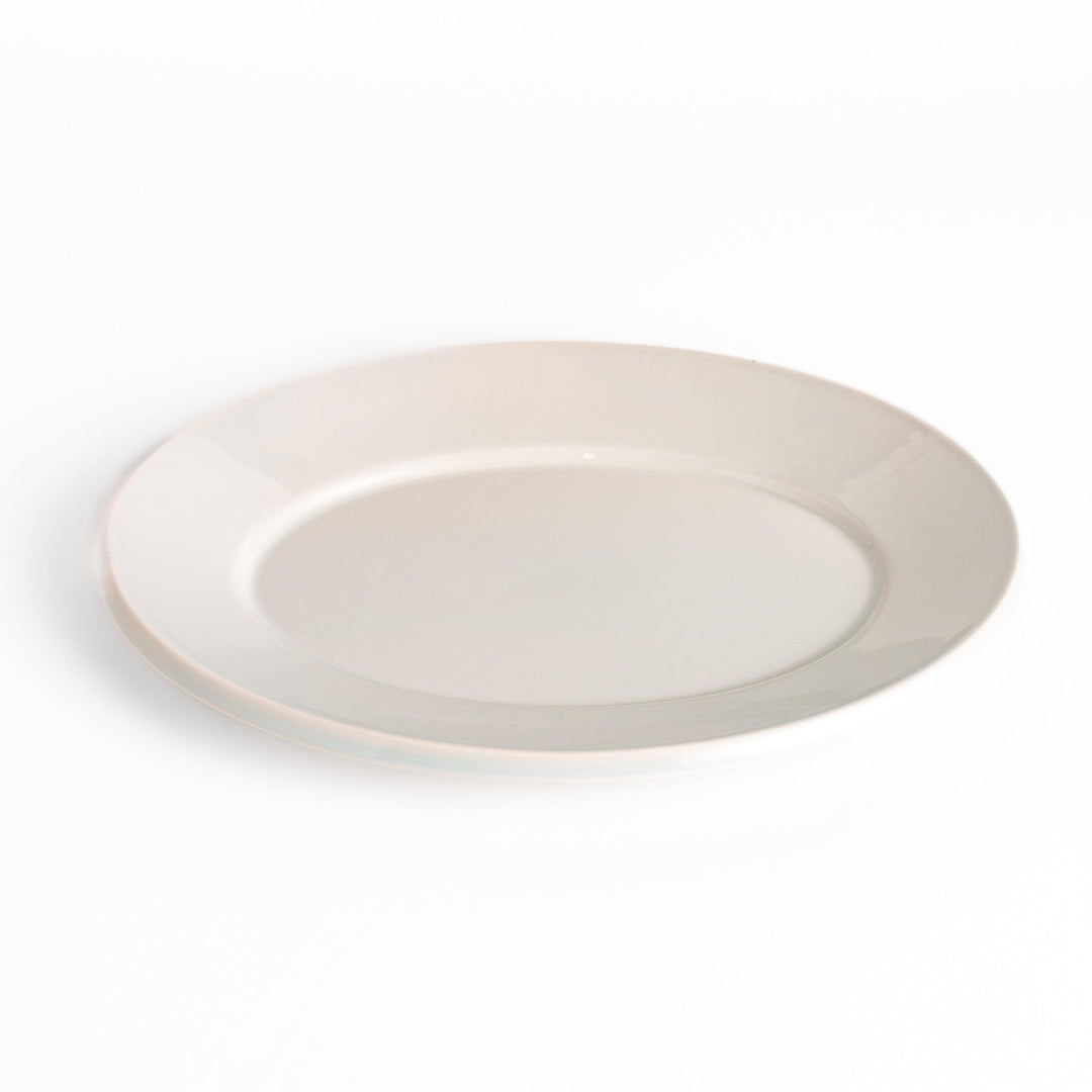 Durable and elegant white ceramic dinner plate, adding a pop of color to your table setting.