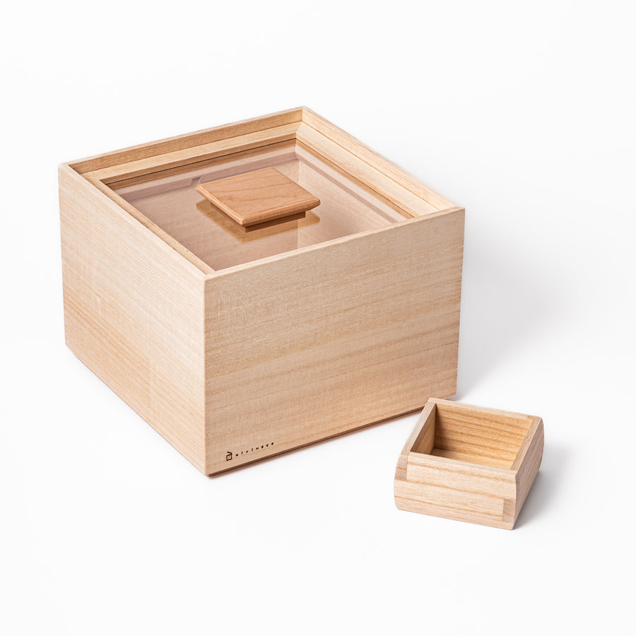 Paulownia wood rice container with airtight lid, handcrafted in Japan to keep rice fresh, lightweight, and naturally moisture-resistant.