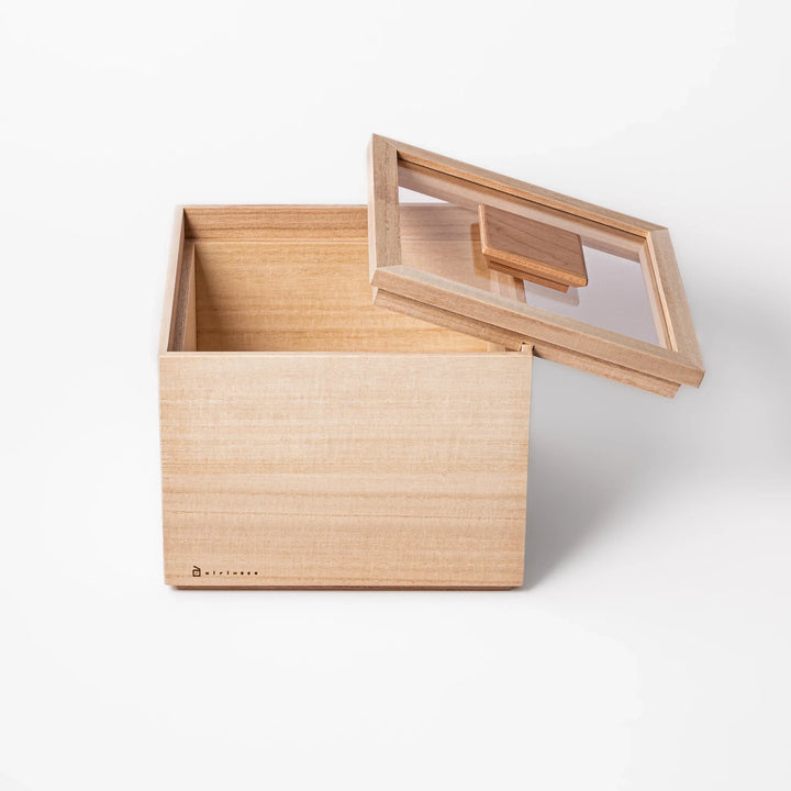 Paulownia wood rice container with airtight lid, handcrafted in Japan to keep rice fresh, lightweight, and naturally moisture-resistant.
