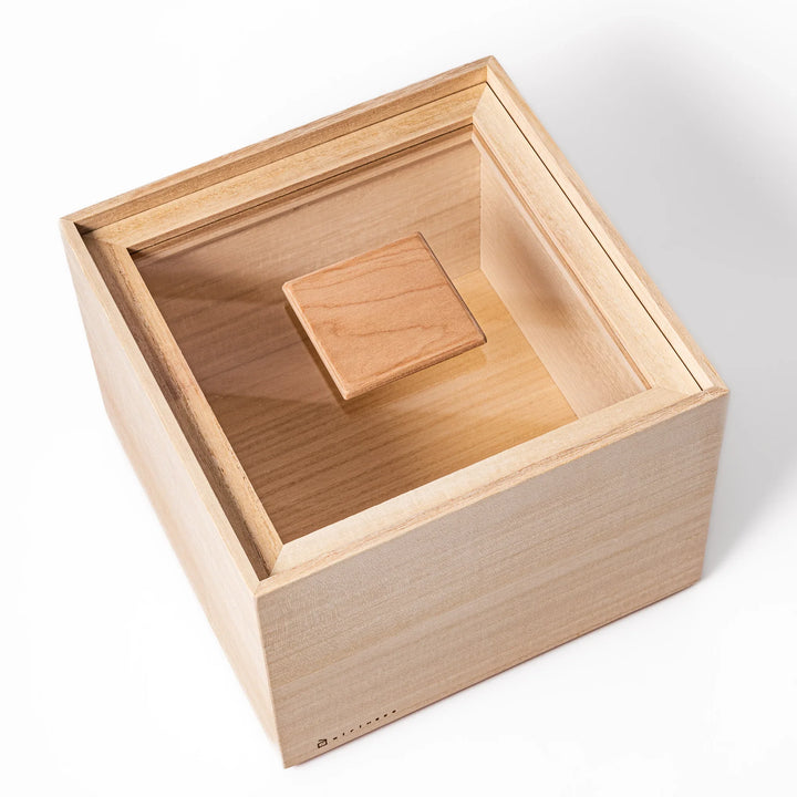 Paulownia wood rice container with airtight lid, handcrafted in Japan to keep rice fresh, lightweight, and naturally moisture-resistant.