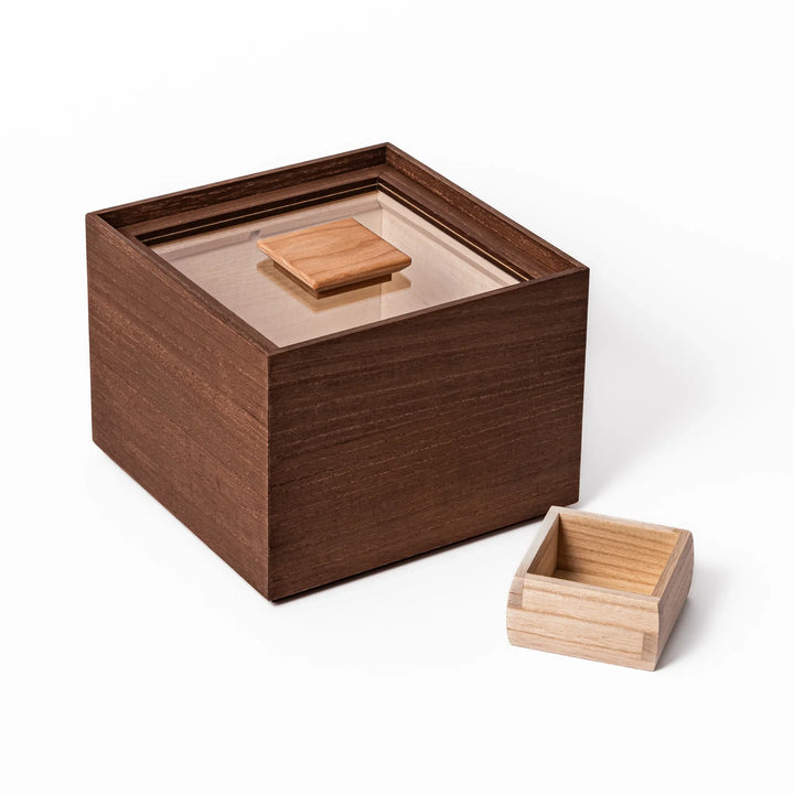 Dark brown paulownia wood rice container with airtight lid, handcrafted in Japan to store up to 3 kg rice while keeping it fresh and dry.