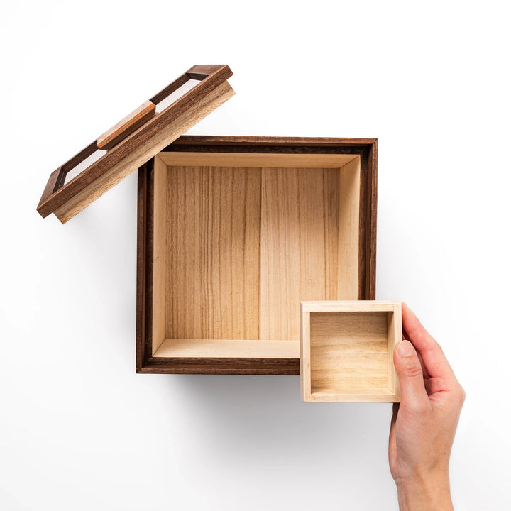 Dark brown paulownia wood rice container with airtight lid, handcrafted in Japan to store up to 3 kg rice while keeping it fresh and dry.