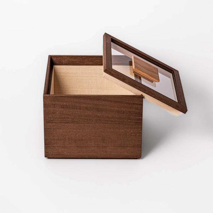 Dark brown paulownia wood rice container with airtight lid, handcrafted in Japan to store up to 3 kg rice while keeping it fresh and dry.
