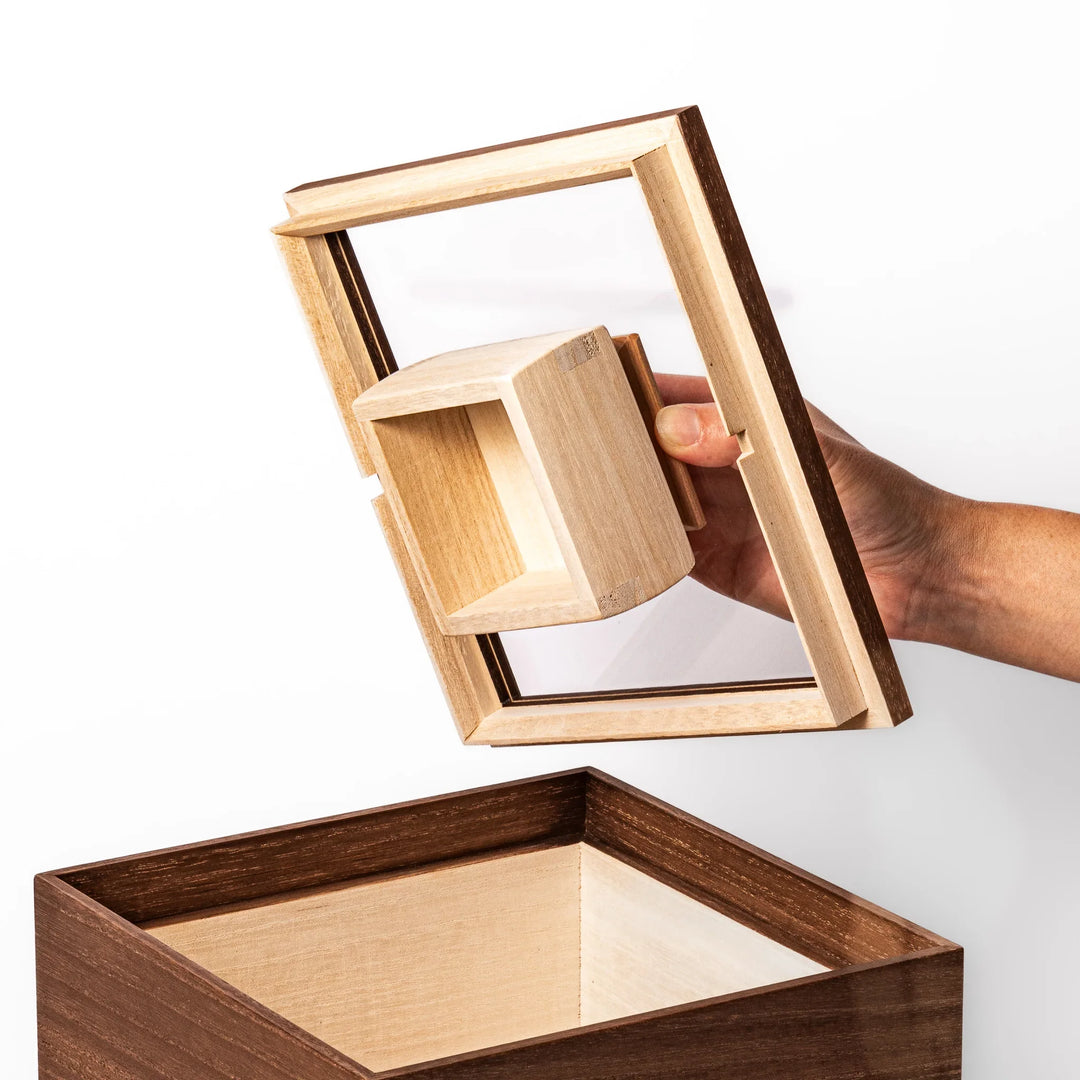 Dark brown paulownia wood rice container with airtight lid, handcrafted in Japan to store up to 3 kg rice while keeping it fresh and dry.