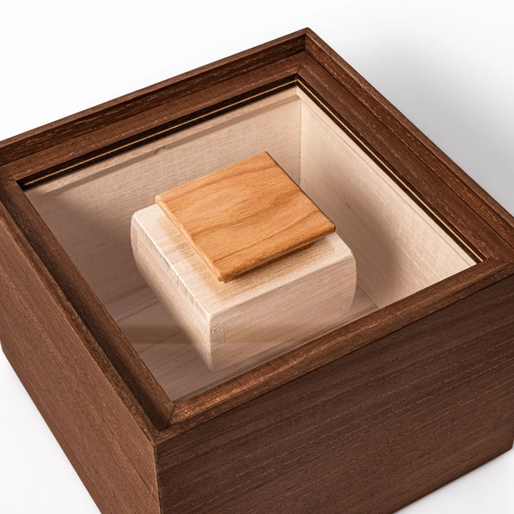 Dark brown paulownia wood rice container with airtight lid, handcrafted in Japan to store up to 3 kg rice while keeping it fresh and dry.