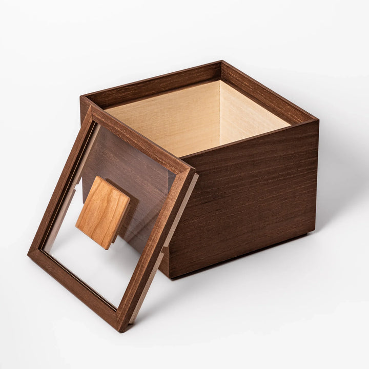 Dark brown paulownia wood rice container with airtight lid, handcrafted in Japan to store up to 3 kg rice while keeping it fresh and dry.