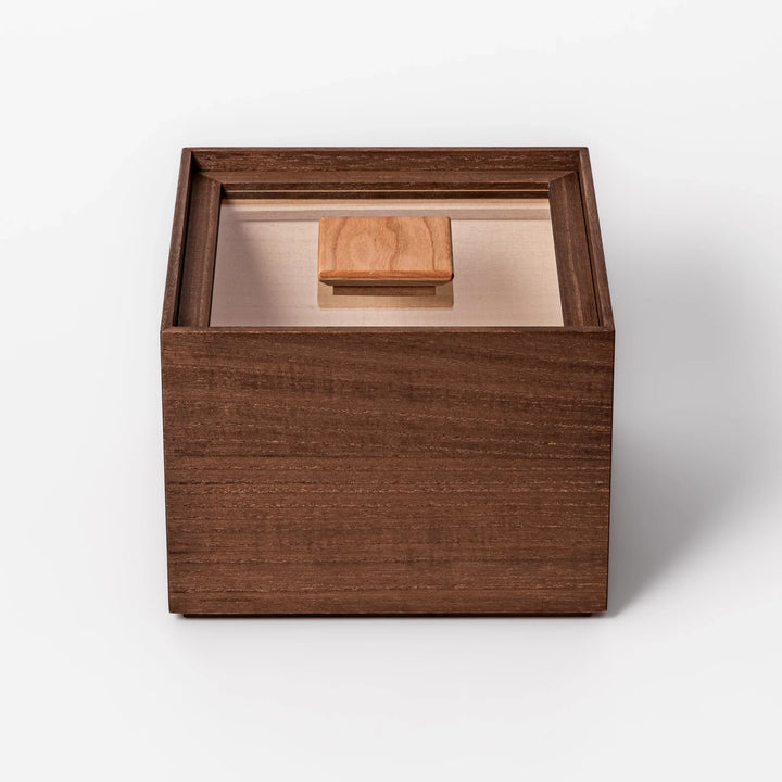 Dark brown paulownia wood rice container with airtight lid, handcrafted in Japan to store up to 3 kg rice while keeping it fresh and dry.