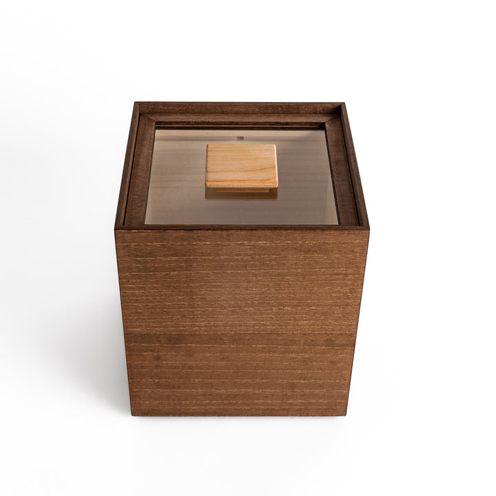 Japanese paulownia wood rice storage box with a clear lid and wooden handle, designed to keep rice fresh by naturally regulating humidity and preventing pests.