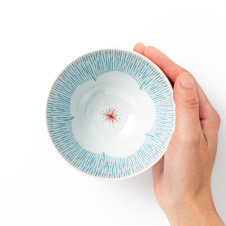 Japanese ceramic rice bowl with plum petal stripe design in blue, blending modern elegance with traditional Japanese tableware