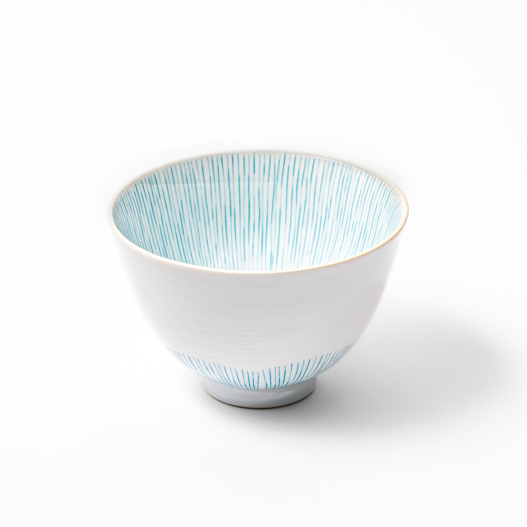 Japanese ceramic rice bowl with plum petal stripe design in blue, blending modern elegance with traditional Japanese tableware