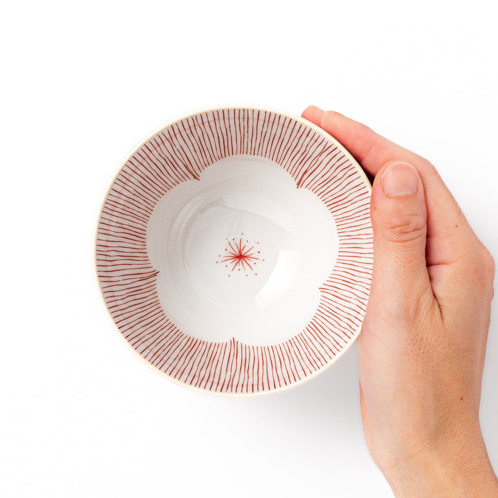 Japanese ceramic rice bowl with plum petal stripe design in red, perfect for daily dining with a blend of tradition and modern style
