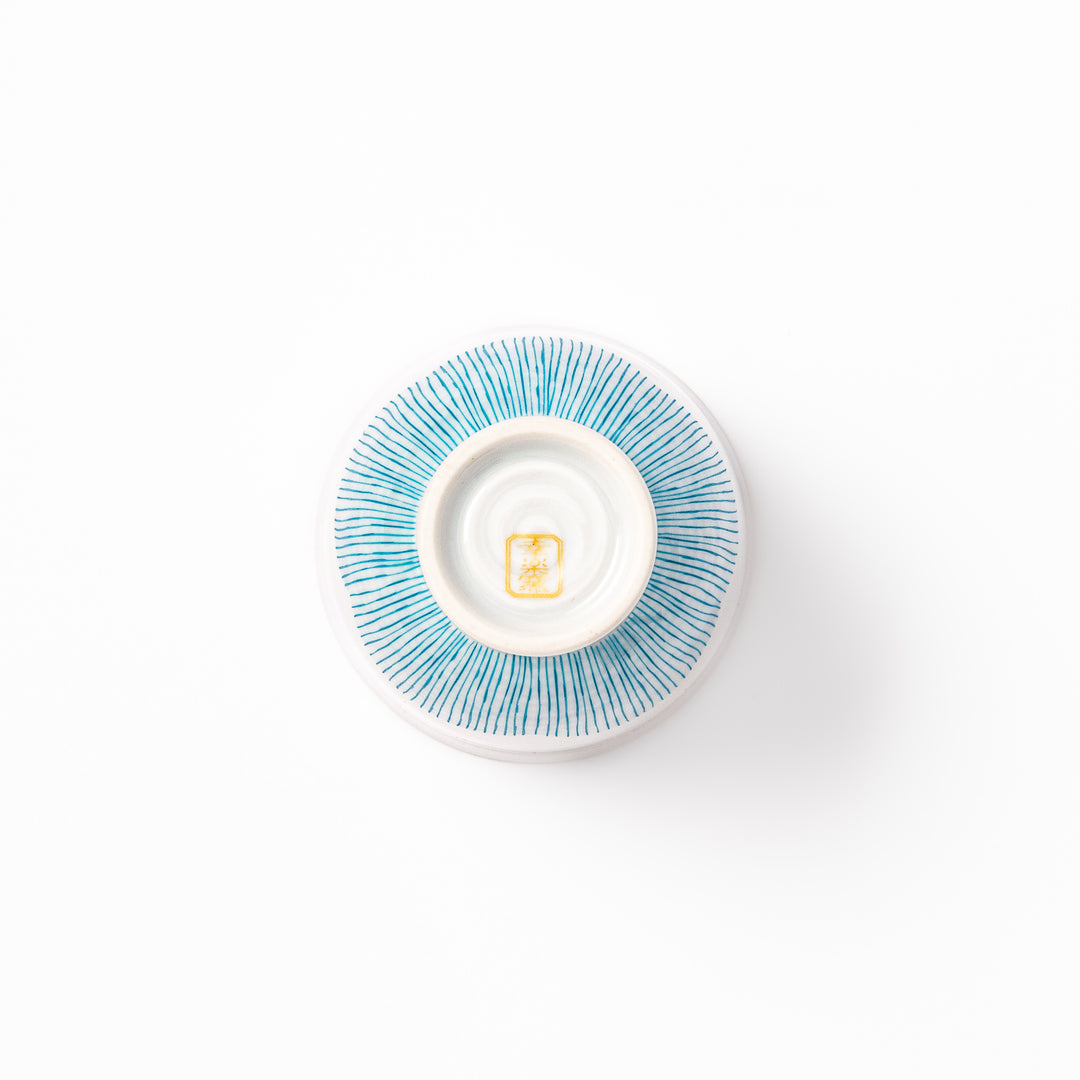Japanese ceramic tea cup with plum petal stripe design in blue, showcasing minimalist elegance and traditional Japanese craft
