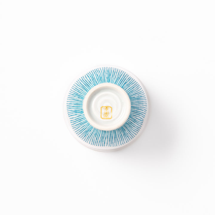 Japanese ceramic tea cup with plum petal stripe design in blue, showcasing minimalist elegance and traditional Japanese craft
