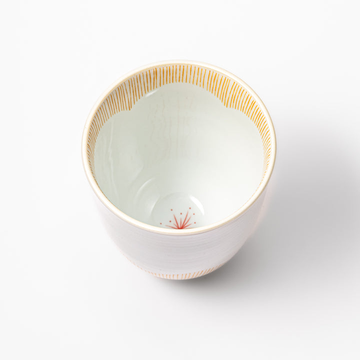 Japanese ceramic tea cup with plum petal stripe design in orange, combining modern minimalism and traditional Japanese style